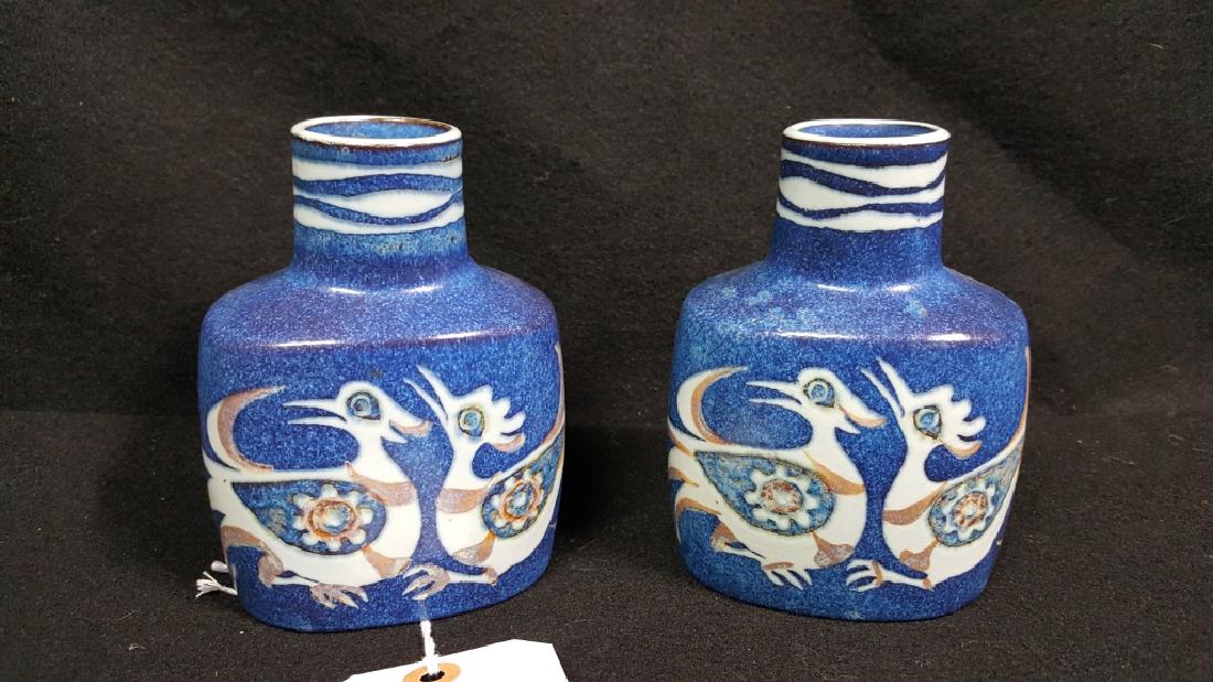 A Pair Of Royal Copenhagen Fajance Vases: A Pair of small Royal Copenhagen vases (5.25" tall, 3 7/8" across foot) decorated with birds. Artist cipher for Nils Johan Thorvald Thorsson.