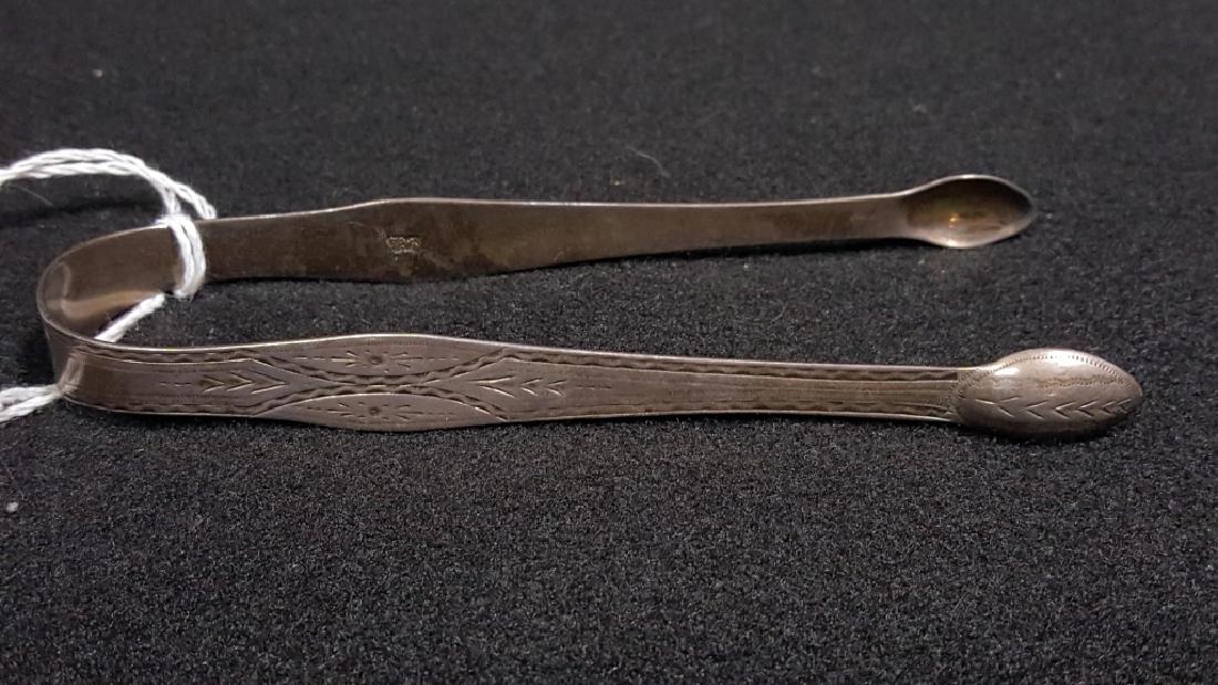 Antique English Hester Bateman Sugar Tongs: 5.25" long. With "HB" script mark, (lion), (King's head left). C. 1784. Engraved exterior design- with monogram "M / W & M'. Bateman 1708-1794.