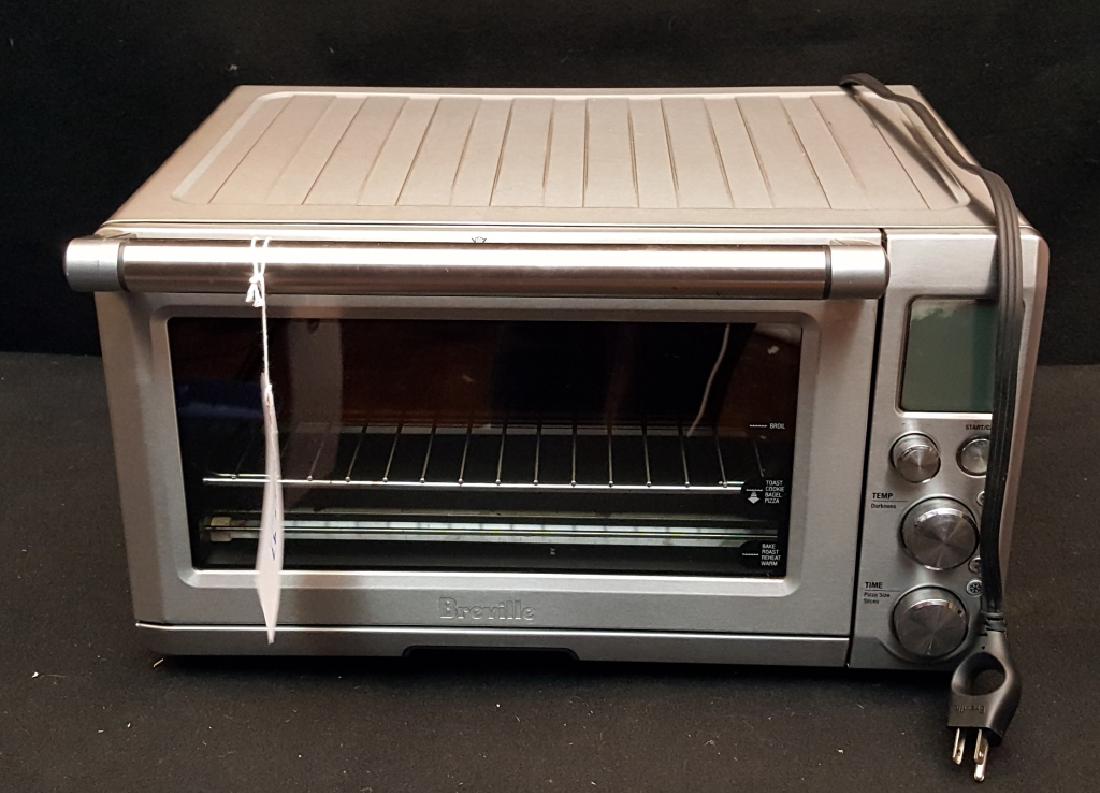 Breville Convection Toaster Oven BOV800XL: Previously owned, barley used VERY CLEAN.