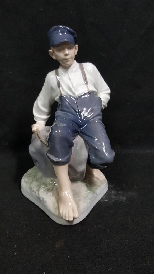 Royal Copenhagen Figure Shepherd Boy On Rock: Large Royal Copenhagen figure 12". Shepherd reclining on rock. Number 1659. Excellent condition. Part of a large collection of Royal Copenhagen figures in this auction.