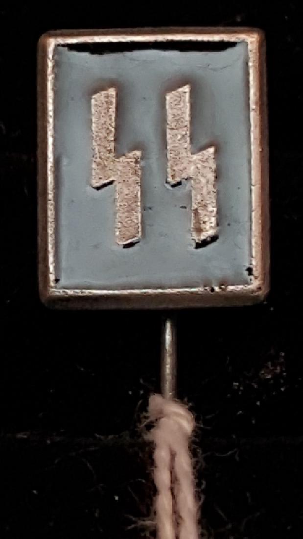 WWII German SS Stick Pin. Numbred on the back: There are numbers and an insignia stamped on the back of this pin. Numbers are 183. I have taken pictures of the insignia. Please let me know if you have any questions. Part of a 44 Piece GERMAN WWII