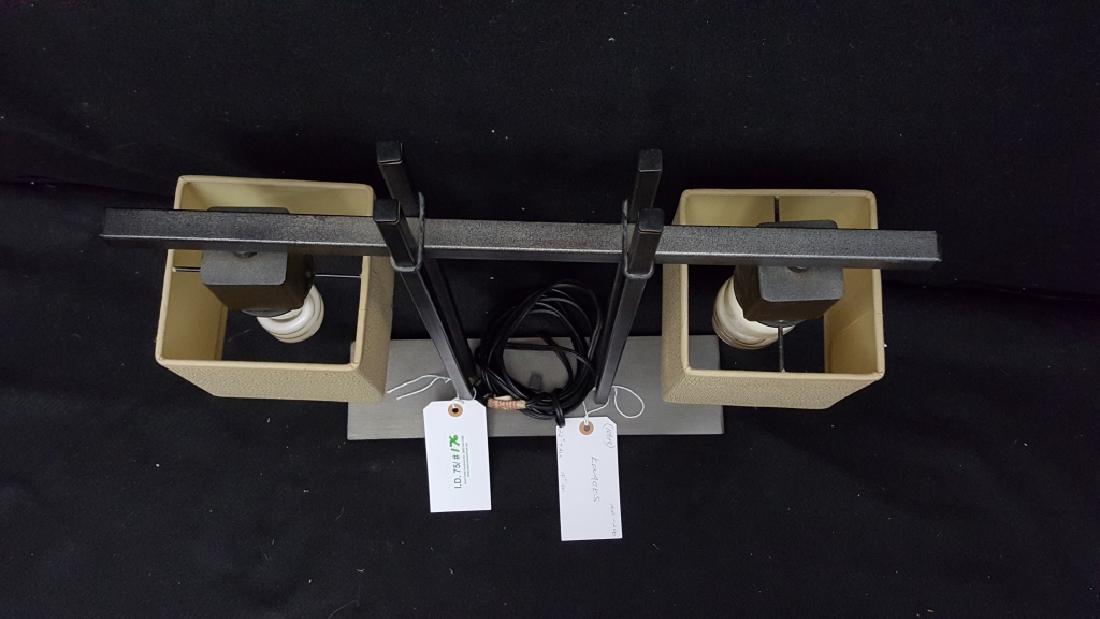 A Modern Kovacs 2 Light Table Lamp: The two light table lamp appx. 22" tall, 19" wide. With "Kovacs" label on base, and a 1999 manufacture lable.