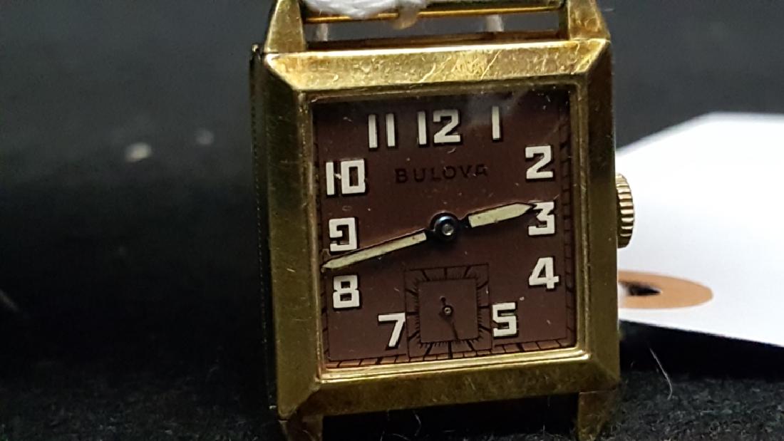 Antique Bulova Wrist Watch: Nice Art Deco Square Cased Bulova. Pink gold face. 15J Bulova movement. Watch not running.