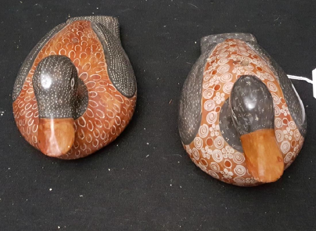Pair of AMADO GALVAN, Signed Duck Tonala Burnished: Pair of signed burnished ceramic ducks by the famed Tonala folk artist, Amado Galvan. They both measure approximately 10" in length x 5.5" in height x 5" in width. Amado Galvan's signature is on the u