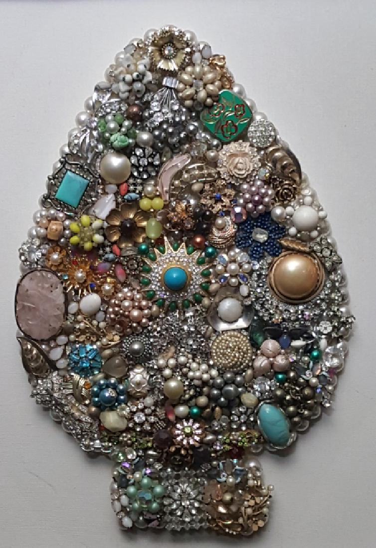 Turquoise, Jade gemstones and more: Eclectic collage of vintage brooches arranged in the shape of a spade. Framed 19 x 23