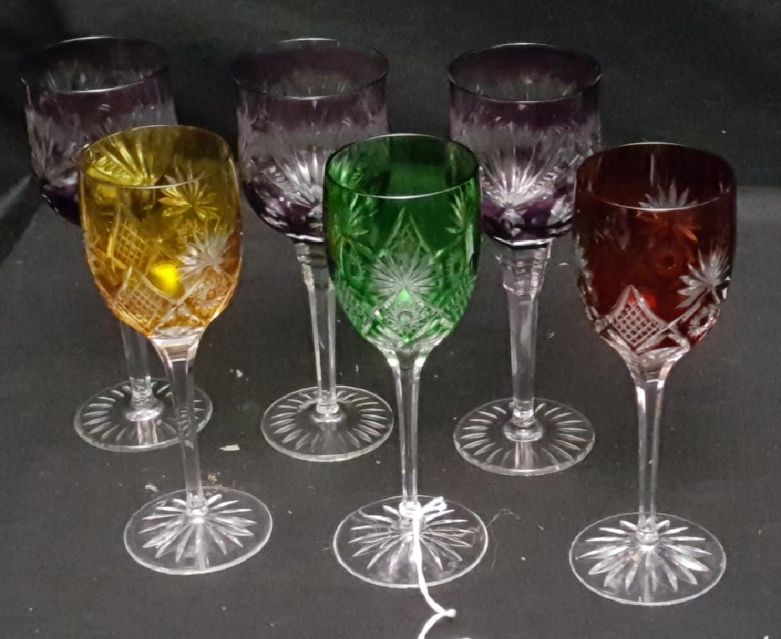 Nachtmann Bohemian Cut to Clear Crystal Stemware: A set of (3) Bohemian amethyst to clear cut crystal wine glasses 8 3/8". Along with a set of (3) multi-colored to clear cut crystal wine glasses, with water mark on base.