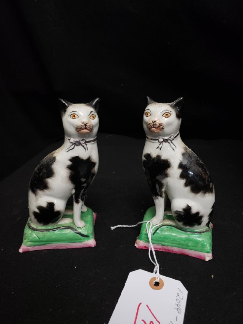 A Pair of Staffordshire Cat Figures: Old Staffordshire Ware England, 7". A few small corner chips.