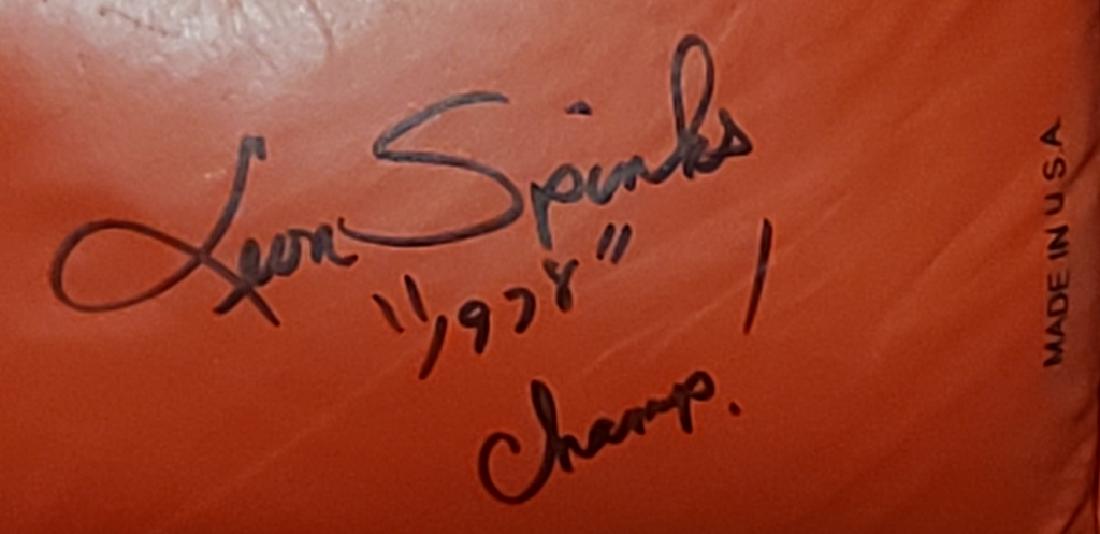 Leon Spinks "1978 Champ!" Autographed Boxing Glove: An official Everlast size 14, signed with black marker by Leon spinks "1978 Champ!.