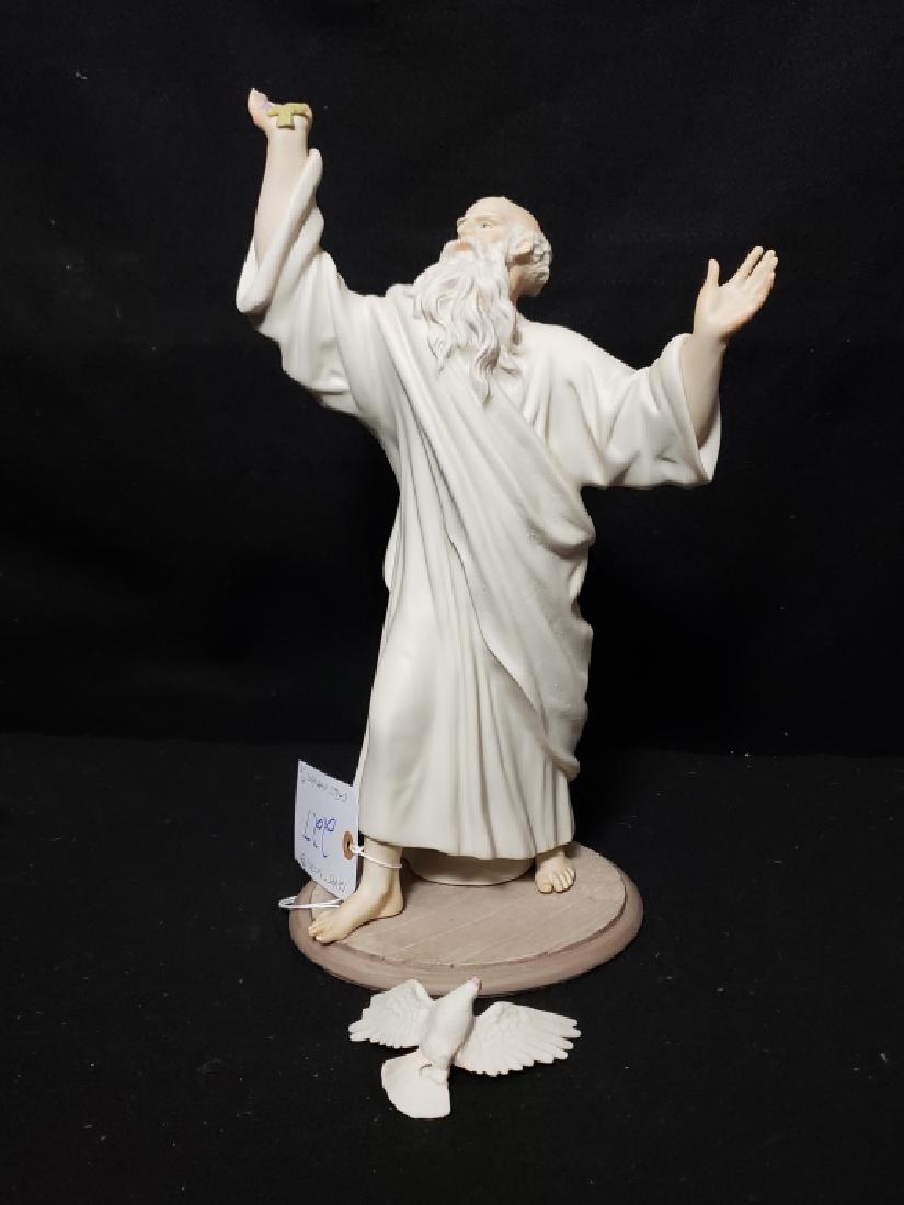 Cybis Noah with Dove Figure: Large size Noah figure with dove; dove is broken off from the hand but present. May be some damage to leaf on upraised hand (?).