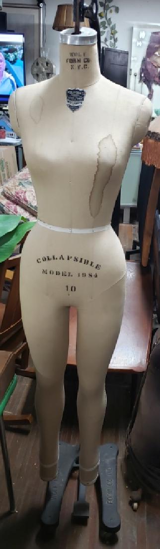 Wolform Large Dress Form Mannequin With Stand: A dress form mannequin on cast iron rolling stand. Standing 76" total.