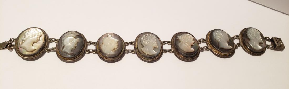 Mother of Pearl & Abalone Shell Bracelet: 7" length on just the 7 cameos. Each cameo appx. 1" tall. Not marked but certainly silver.