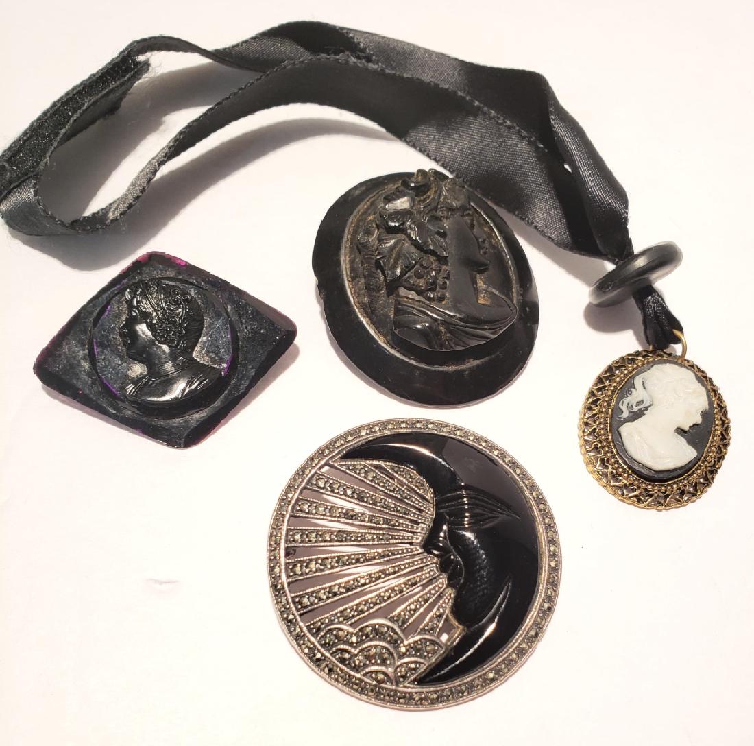 Vintage Lot of Silver & Other Jewelry: Sterling & marcasite circle pin with half moon in onyx, antique gutta percha cameo, black plastic cameo pin, Lisa Violetto cameo pendant on silk.