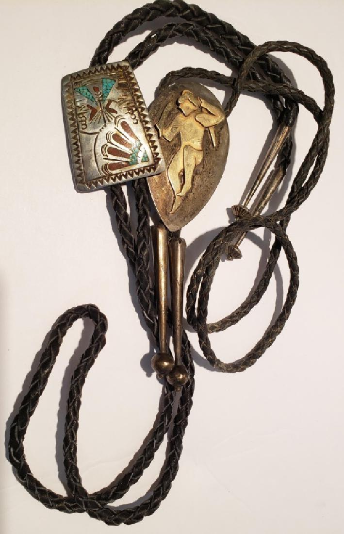 Southwestern Bolo Tie Lot (2): One inlaid with coral and turquoise, back signed "Bennett" (with silver tips), the other a gold (?) colored dancer, signed on the reverse with an image of a human face and "Sterling / C/ By Hand"; als