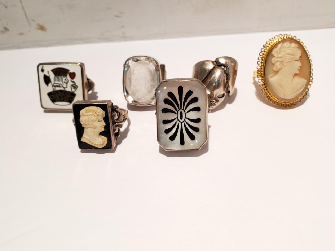 Group Lot Of 6 Assorted Rings Cameos & More: Sterling "Jack of Hearts" enamel ring, sterling & MOP black design ring, sterling & intaglio crystal face, costume cameo ring, sterling mask, sterling & black onyx cameo.