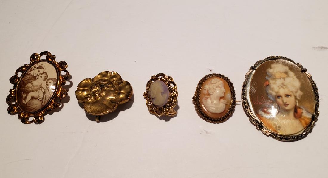 Pins & Brooches Lot , 5 pcs: Art nouveau woman in profile, 2 small costumne cameos, sepia toned image of children in gilt pin, painted woman signed "Walter" in silver and marcasite frame.