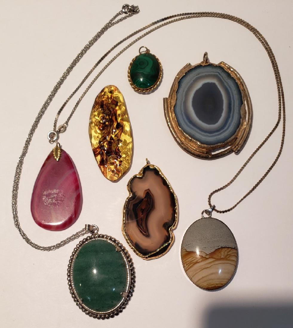 Group of 7 Stone Pendants: Yellow tortoiseshell glass with "runes" on reverse, 2.25", brown with gold plate coating, blue agate with silver rim, pink banded pendant, green stone on sterling chain, malachite oval, brown / blue s