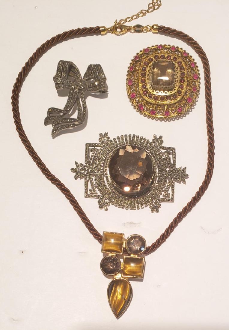 Sterling Pin / Marcasite Group (4): Larger sterling & marcasite pin with light brown large stone at center (2.5" overall), signed "JJ" (Judith Jack?), gold colored .950 silver pin with red stones, plae yellow brown stone at center, silv