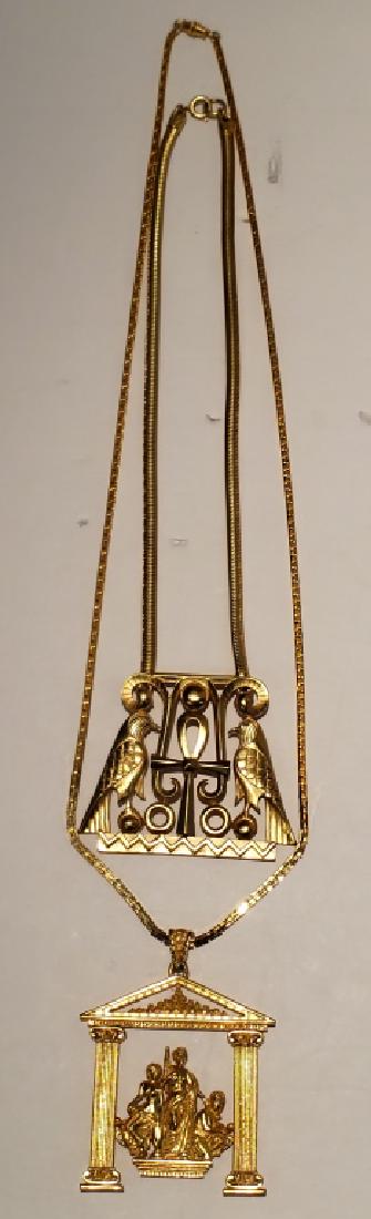 Two Large Trifari Pins Egyptian & Greek: The first with two hawks on either side of an ankh, 2.5" tall x 3" wide, Trifari with a "crown" T, the second with 3 female figures in a Greek temple, same signature, 3" tall x 2.5" wide.