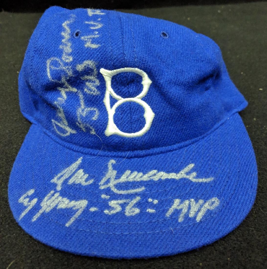 Brooklyn Dodgers Don Newcombe & Johnny Podres: A Brooklyn Dodgers hat autographed by pitching great Doon Newcombe, inscribed "Cy Young-"56"-MVP". Along with Johnny Podres, inscribed "55 W.S. M.V.P.".