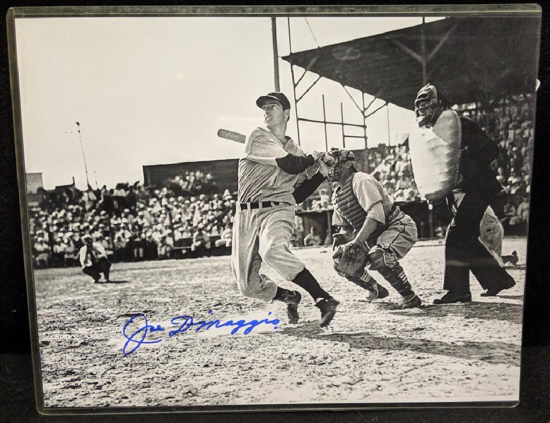 NYY Joe DiMaggio Autographed 11" X 14" B/W Print: A black and white 11" X 14" photo / print of the legendary New York Yankee Joe DiMaggio, autographed by Joe with a blue marker. COA from The Score Board.