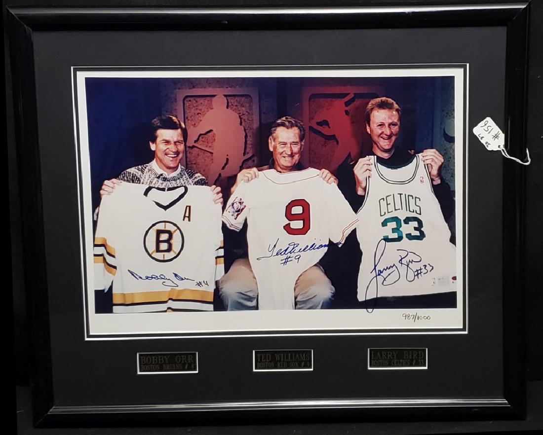 Trio of Boston Sports Legends Orr, Williams & Bird: A signed and numbered 987 / 1000 photo / print "Trio of Boston Legends". Signed by Boston Bruins Bobby Orr #4, Red Sox Ted Williams #9 and Celtics Larry Bird #33. With COA from Grand Slam Marketing.