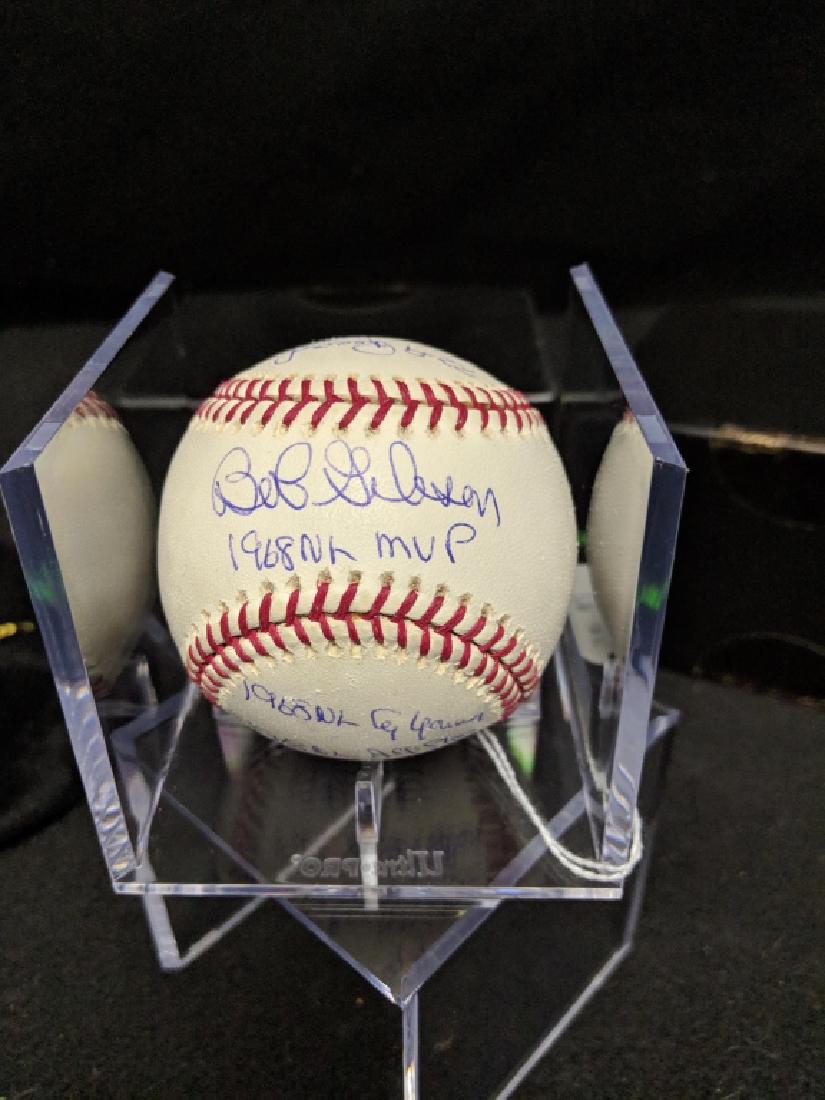 Bob Gibson MVP Statball Signature & Inscriptions: A Bob Gibson autographed MVP statball, with the following inscriptions: 1968 NL MVP, NL Cy Young, Gold Glove, NL All Star, 1.12 ERA, 268 K's, 22-9 Record, 13 Shutouts and 28 Complete Games. The ball i
