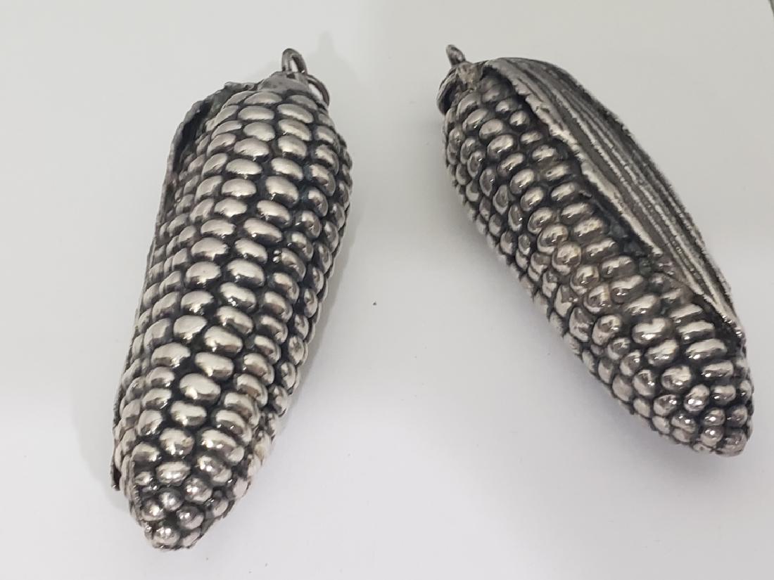 Two Sterling Silver Ears Of Corn 3": Each marked .925 on the suspension hoop. No other marks apparent.