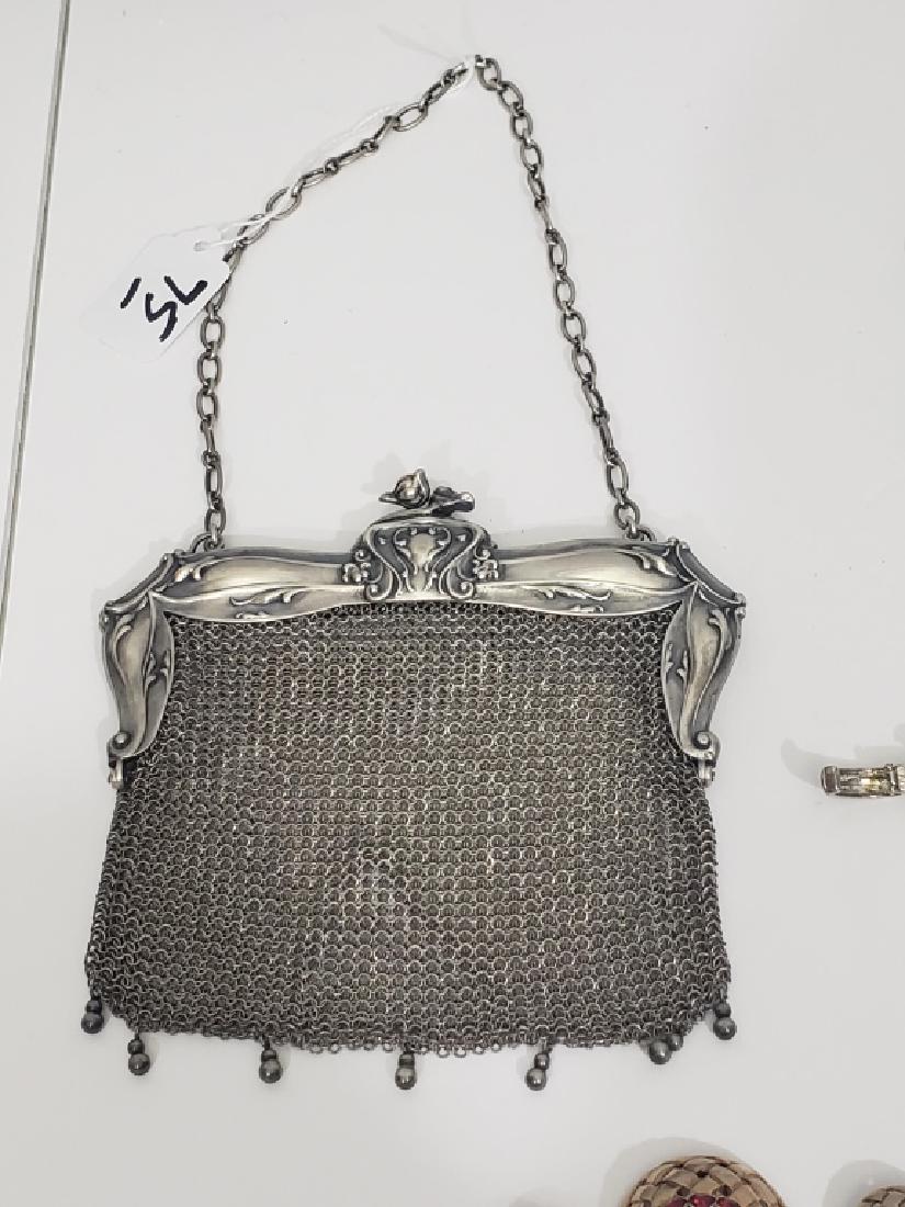 Sterling Silver Frame Mesh Antique Purse: Lovely silver frame purse. 6" widest point, 6" clasp to hanging bead. "Sterling / 610" on interior of frame; unknown maker's mark of a 8 pointed "sun".