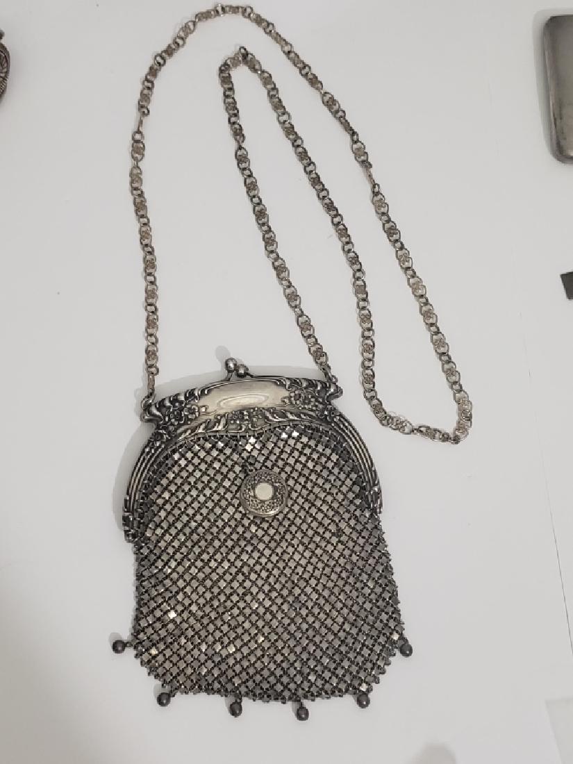 Antique Sterling Silver Purse: Measures 6" from top of clasp to bottom of beads. 4 1/8" wide. Beautiful high relief floral frame. With tiny attached locket (?) on reverse. Frame marked "Sterling / 328" no company name evident.