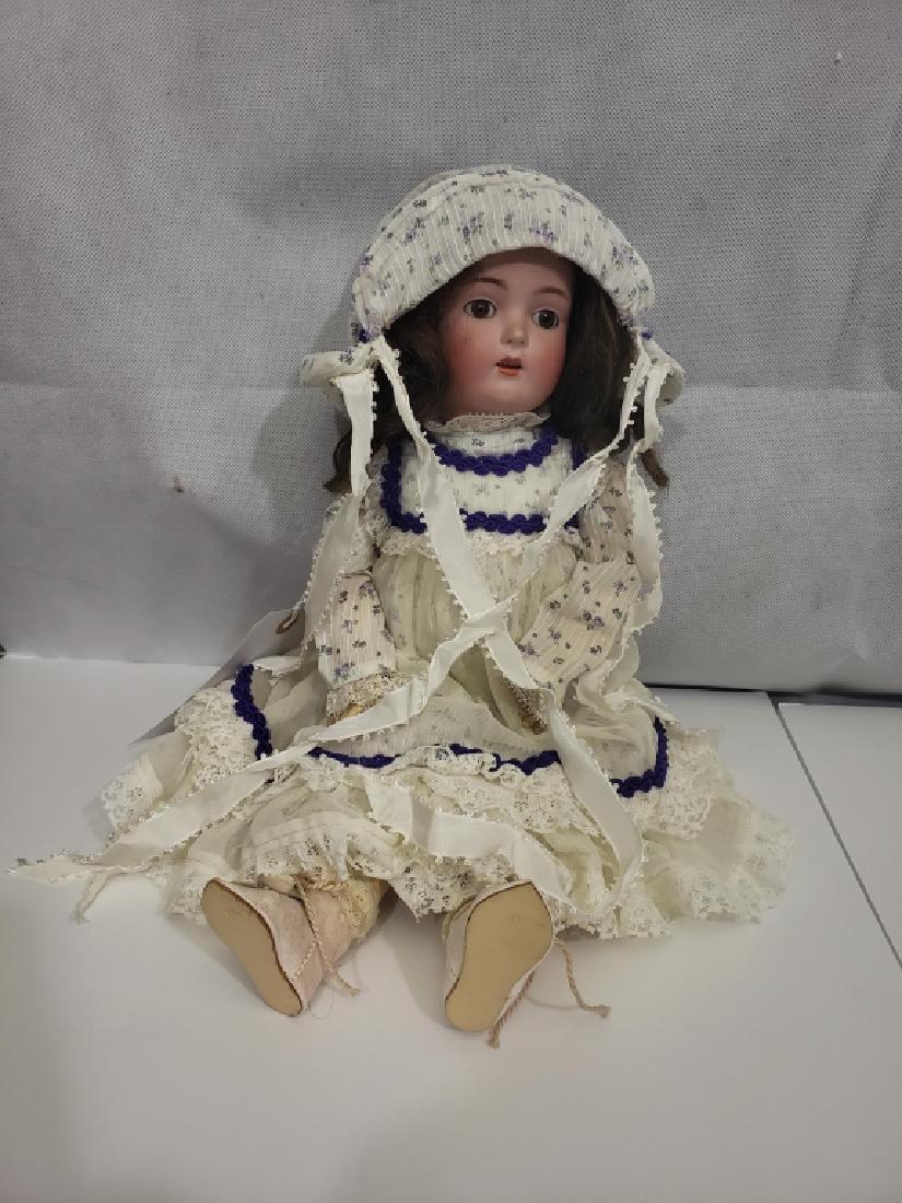 Antique Kestner German Doll Brown Paperweight Eye: Porcelain head with composition body. Probably modern / replaced clothes. Roughly 17.5" overall height. With sleeping, brown paperweight eyes. Rear of head marked "Made In / Germany", "6 1/2" "7 1/2",