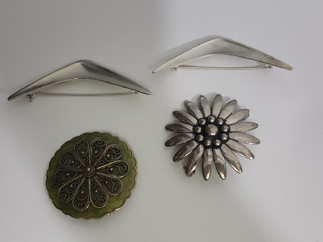 Antique Sterling Denmark Pins Lot (4 pcs): 1) round flower shaped pin 1.75" ("Sterling / Bratbj/ Denmark"), 2) sterling and light green enamel round pin 1 5/8", (".925S/ Sterling/ Norway"), 3) Boomerang shaped pin, 2.75" ("Sterling/ S.C.F./ De
