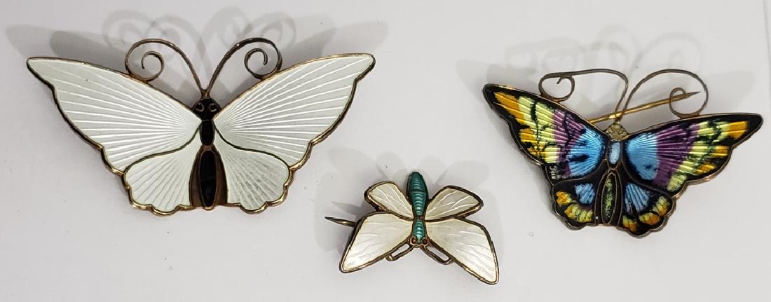 3 Small Sterling Silver & Enamel Butterflies: 1) David Andersen, white enamel wings, black body, 2" largest, 2) David Andersen, brightly colored, 1.75" largest, antennae somewhat bent, 3) White and blue, "Sterling Norway", 1" largest dimension.