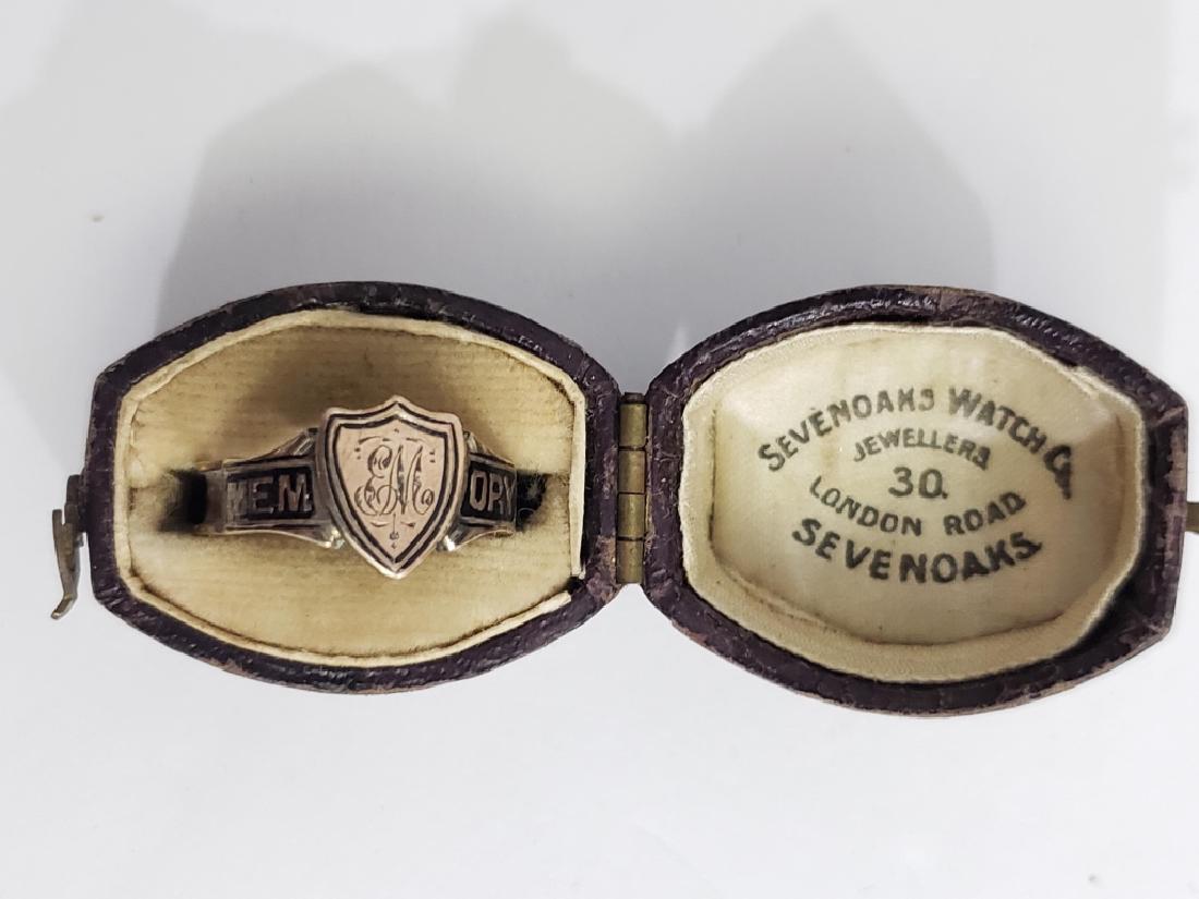 Antique 10K Gold & Black Enamel Memorial Ring: Memory in black enamel on top of ring; shield with initials "EM" at top of ring. Marked "10C" on interior. In a wonderful antique leather ring box "Sevenoaks Watch Co/ Jewellers/ London Road/ Sevenoak