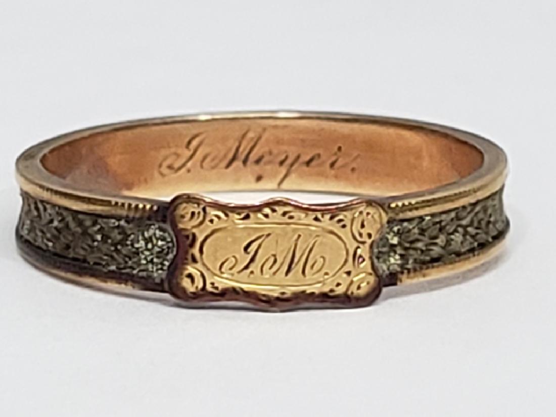 14K Gold & Hair (?) Memorial Ring With Name: Ring has a top cartouche with the initials "J.M.". The ring has a tightly woven line of hair (?) around the exterior. Interior with full name "J. Meyer".