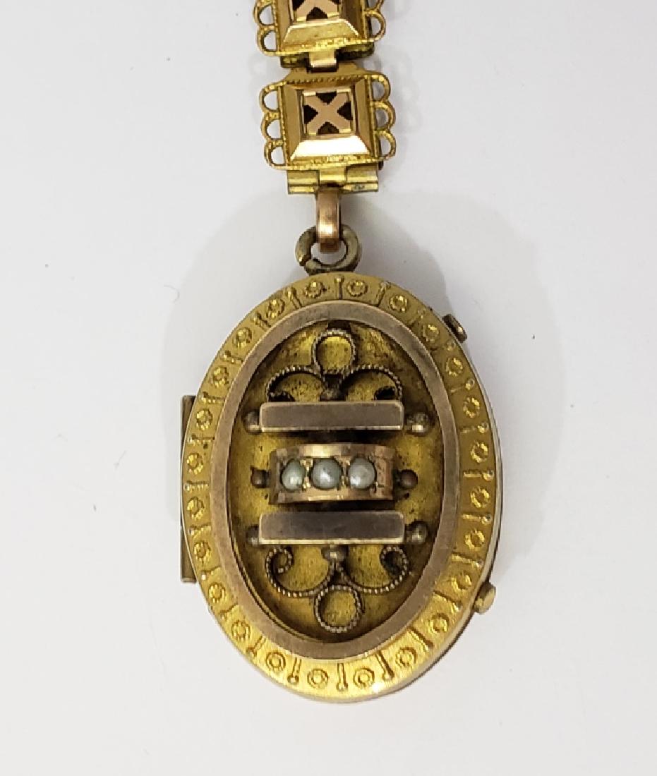Antique English (?) Gold Filled Locket On Chain.: The locket appx. 1 3/16" tall, with 3 small pearls on front. Interior of locket empty but does have 2 glass panels. Locket hangs from a 1" chain portion, which connetcs to a 18" gold filled (?) Victor