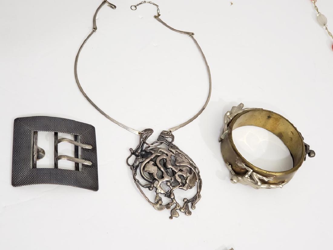 Group Of Artist Made / Unusual Jewelry Sterling: 3 pieces including a bracelet with crawling figures, internal diameter 2.5", 2) silver buckle, 2 5/8", marked ".800", and 3) an abstract pendant, 3.5", apparently unmarked, on a choker length chain.