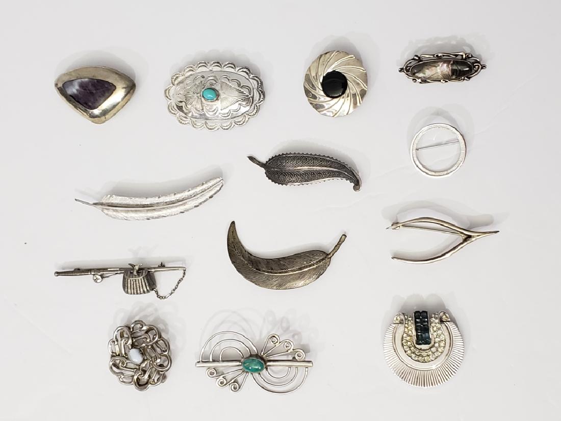 13 Assorted Silver Pins some with stones.: 1) inset purple / white stone, 1.75", 2) Swirl pin with turquoise at center, 2.25", 3) wishbone pin, 2" 4) plain circle pin, 1", 5) feather pin, curved, 2.25", 6) feather pin, 3", 7) feather pin, 2.25