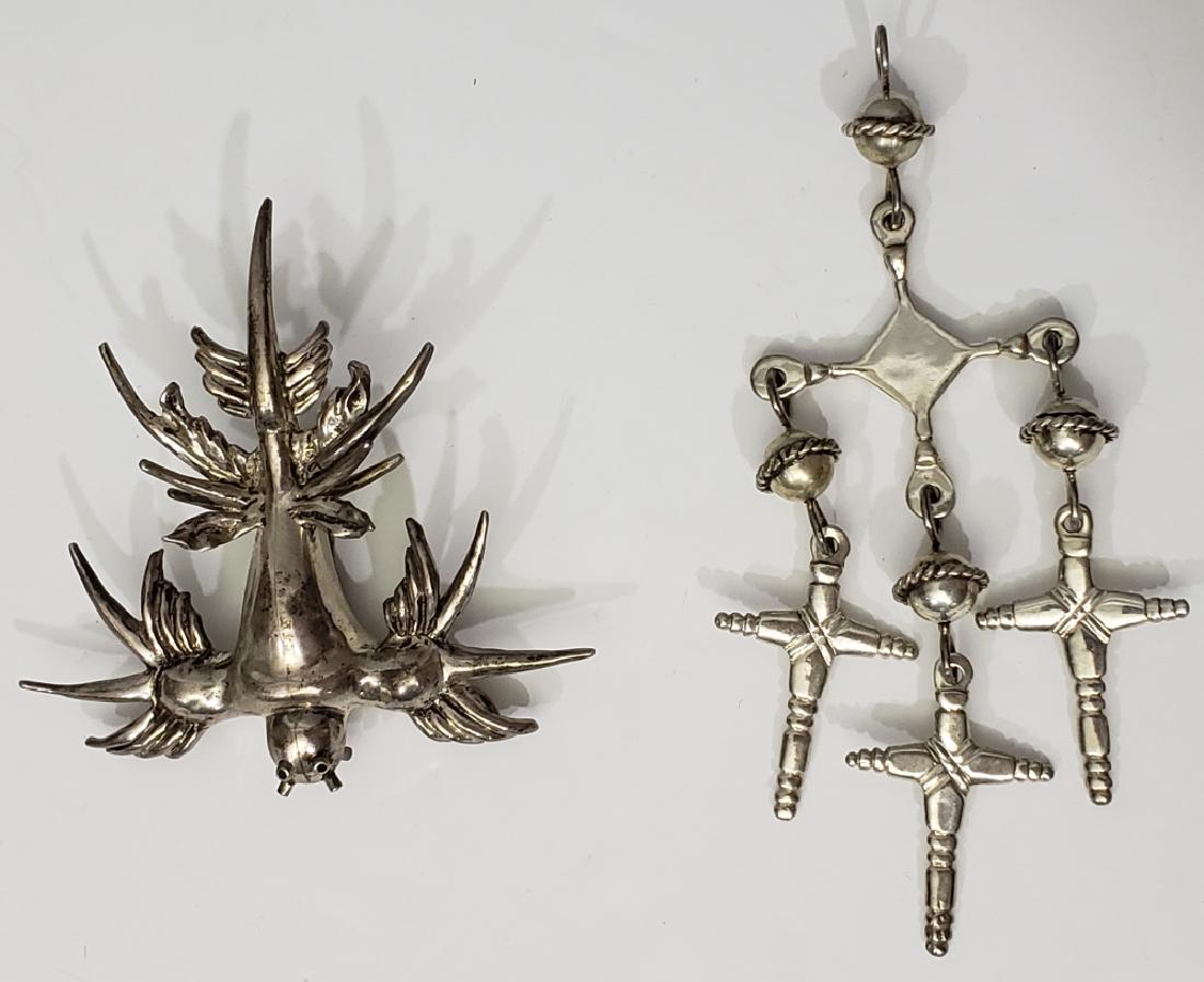 2 Unusual Silver Pins / Pendants: 1) Pendant, 3 crosses suspended from central cross, 5 1/8" overall, "Taxco", "Sterling", other marks, 2) "Scarecrow" pin / pendant, 3.5" overall, apparently unmarked.