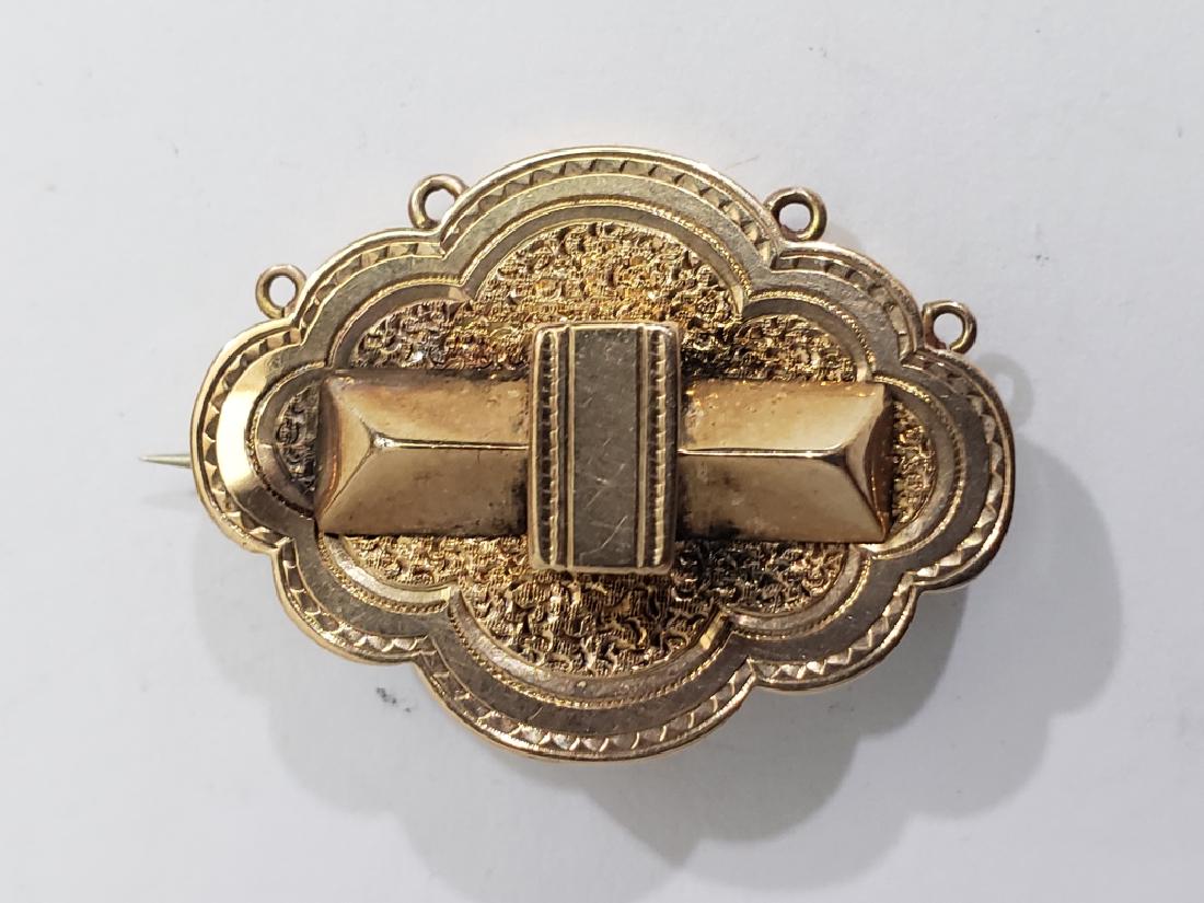 Victorian 14K Gold Pin 1 1/8".: The pin is 1 1/8", and has 4 small suspension hooks at the bottom. There is something missing at the hook spots, probably pearls or small tear drops. 2.5 DWT.