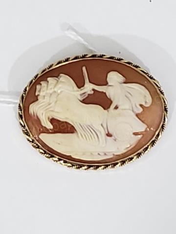 14K Gold Antique Cameo: Carved shell cameo with figure in chariot. 1.5" x 1.25". Marked "14k". 5.9 DWT.