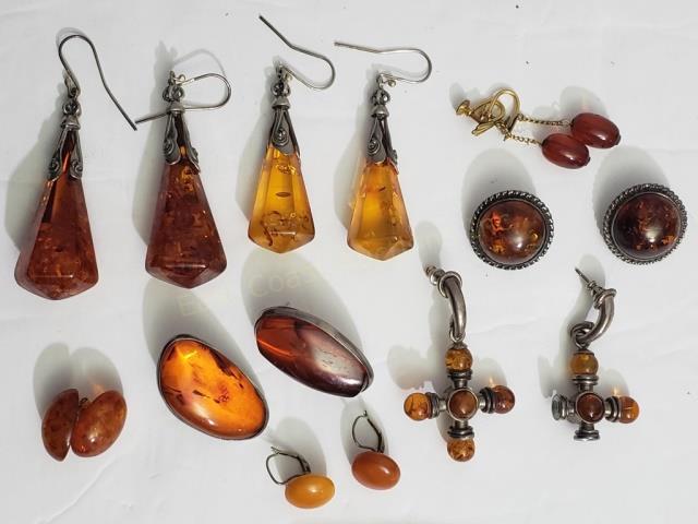 8 Pairs Of Amber Earrings, Sterling, Etc.: Largest appx. 2.5" not including the ear wire. Most set in silver. Crosses missing 2 beads. 60.6 DWT total weight.