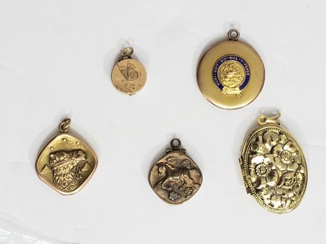 Grouping of 5 Antique / Vintage Lockets: 1) Diamond shape, "horse", 2) Gold colored, flowers in relief, 1 5/8", 3) "Camel" in front of pyramids, 4) Latin Motto, 5) small with engraved butterfly.