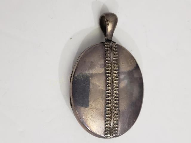 Antique English Victorian Silver Unmarked Locket: Large locket at 1 7/8" x 1.5". No interior in locket. Apparently unmarked. "Zipper" design. 11.6 Dwt.