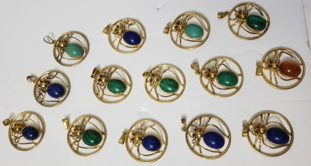 14 Figural Spider Charms Silver With Stones: Each charm appx. 1" diameter. 1 with amber stone, 7 with green / malachite, 6 with blue / lapis; all with red stone eyes. Marked "silver" on the part that would connect to the necklace.