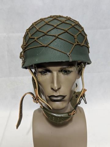 German Paratroopers Helmet with Netting: A reproduction German helmet with head liner, chin strap and clip on netting. 9 3/4" X 8 5/8" X 6"