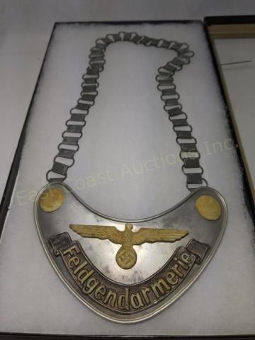 Feldgendarmerie Gorget WW2 Nazi German W/ Chain: Feldgendarmerie Gorget on chain. With glow in the dark paint. With green felt backing. Marked on reverse "R.Z.M. / M34/2". Paint still fluoresces. Badge itself appx. 6.5" x 3".