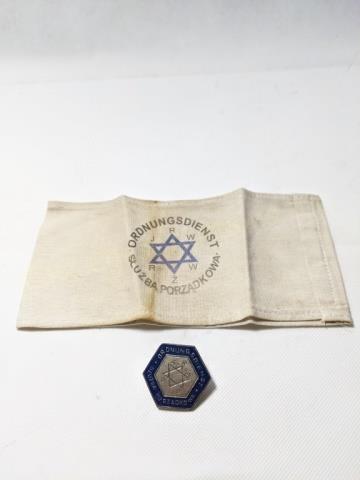 Warsaw Ghetto Badge & Armband WW2 German: 1) Armband with 6 pointed blue star, "JRW RZW", "Ordnungsdienst/ Sluzbaporzadkowa", appx. 8" x 4 1/8", 2) Metal badge, blue enamel border, center with 6 pointed star "Alt R Kiel / G G". with screw bac