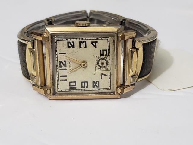 Vintage Mens Bulova Deco Stlye Wrist Watch: Square Cased Bulova Wrist Watch. Case appx. 1" wide excluding winding stem. "Bulova", with sub second hand at 6:00 position. 17J 10AN movement.