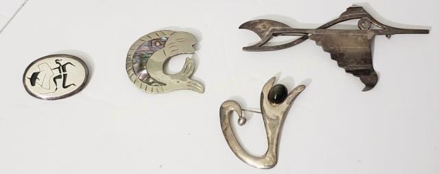 Group of 4 Mexican Silver Unusual Pins Fish Etc.: Large Swordfish (?) 4", "Salvador", "Sterling", 2) Fish with abalone inlay, 1.75", 3) Bullfighter,1 3/8", 4) Abstract form with grey stone, 2". Appx. Total weight of this lot is 1.08 Oz. Troy.
