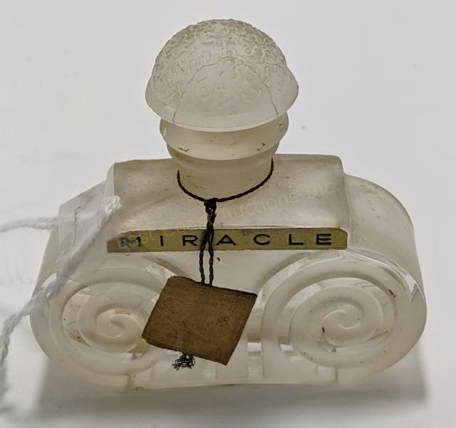 Vintage Frosted Perfume Bottle: 2.5" wide x 2.25" tall. Marked "Miracle". Top seems slightly loose, with frosted design on front and rear of bottle.